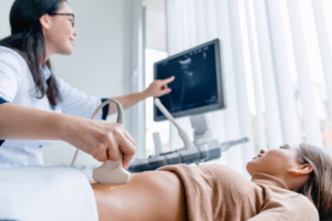 OBGYN Physician giving a patient a Saline-Infused Sonogram.