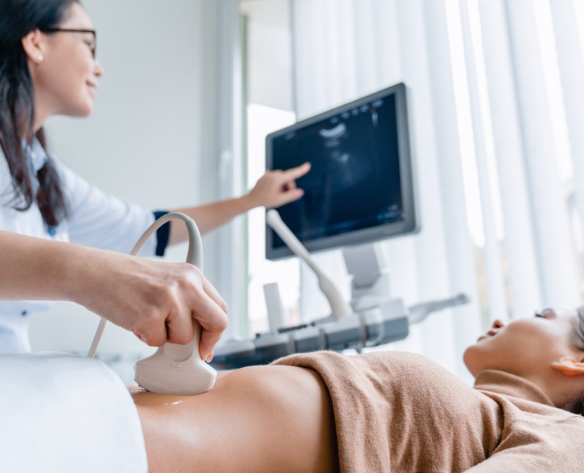 OBGYN Physician giving a patient a Saline-Infused Sonogram.