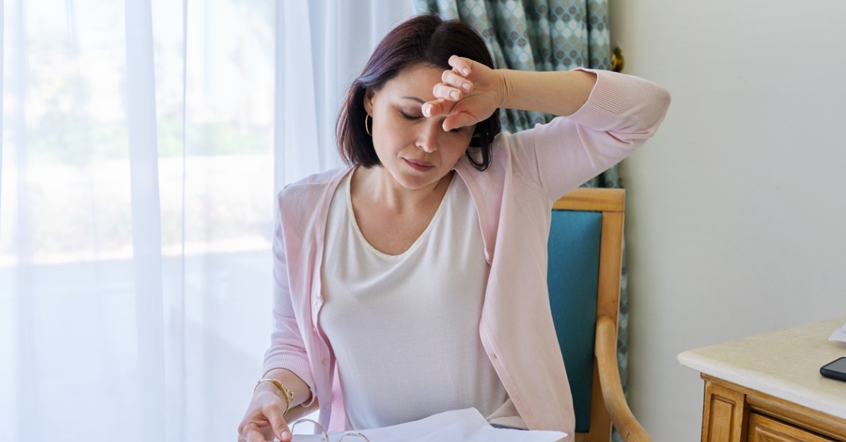 woman having hot flashes