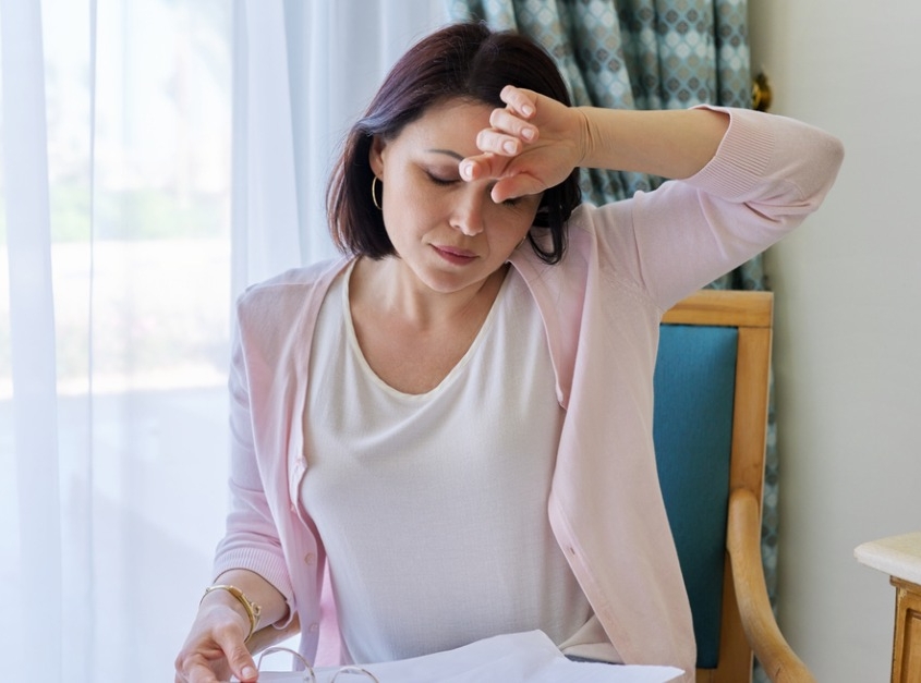 woman having hot flashes