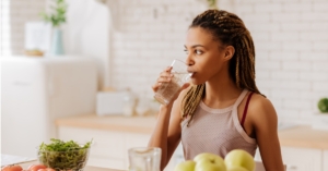 Woman drinking water out of glass