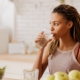 Woman drinking water out of glass