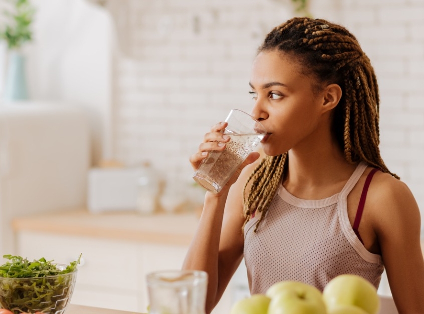 Woman drinking water out of glass