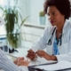 woman speaking with woman doctor