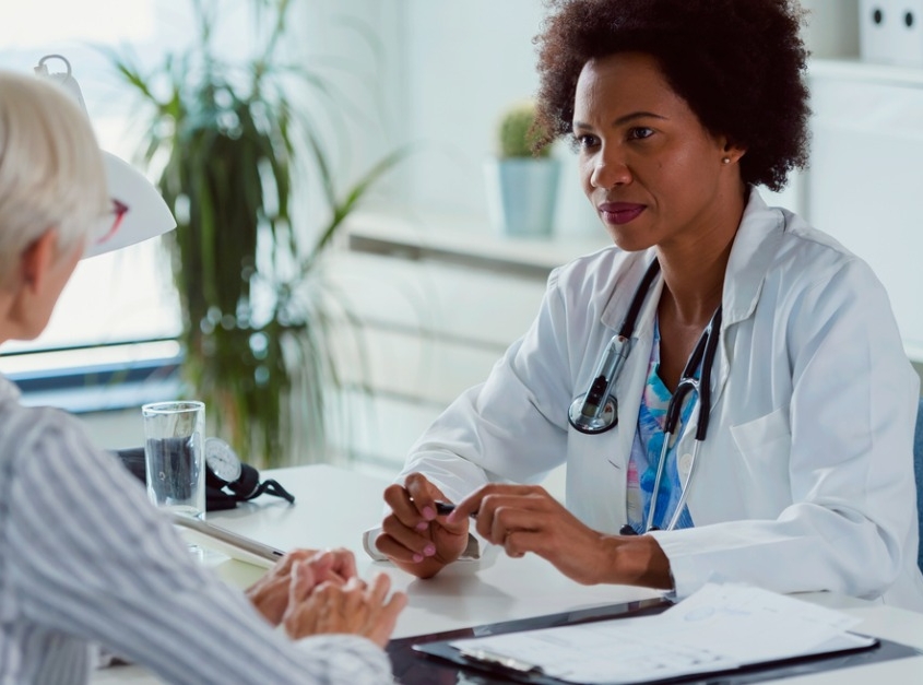 woman speaking with woman doctor