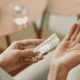 Close Up of Woman Taking Birth Control Pill stock photo